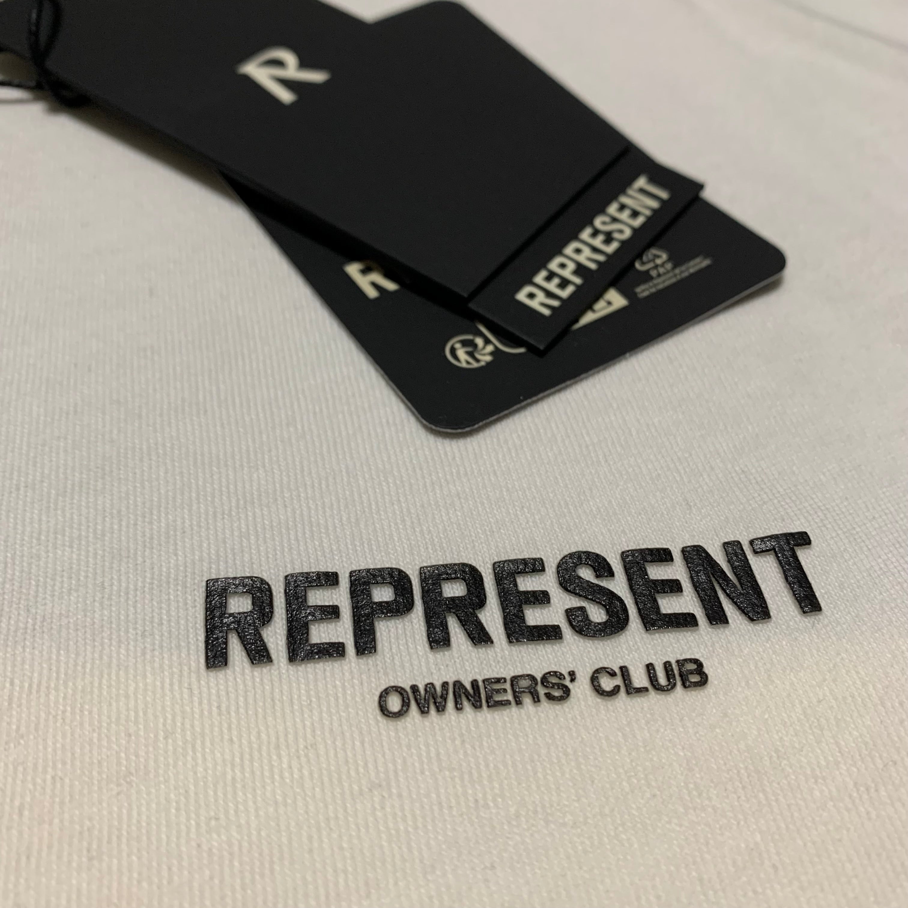 Represent XS Oasis Owners Club Flat White Tee