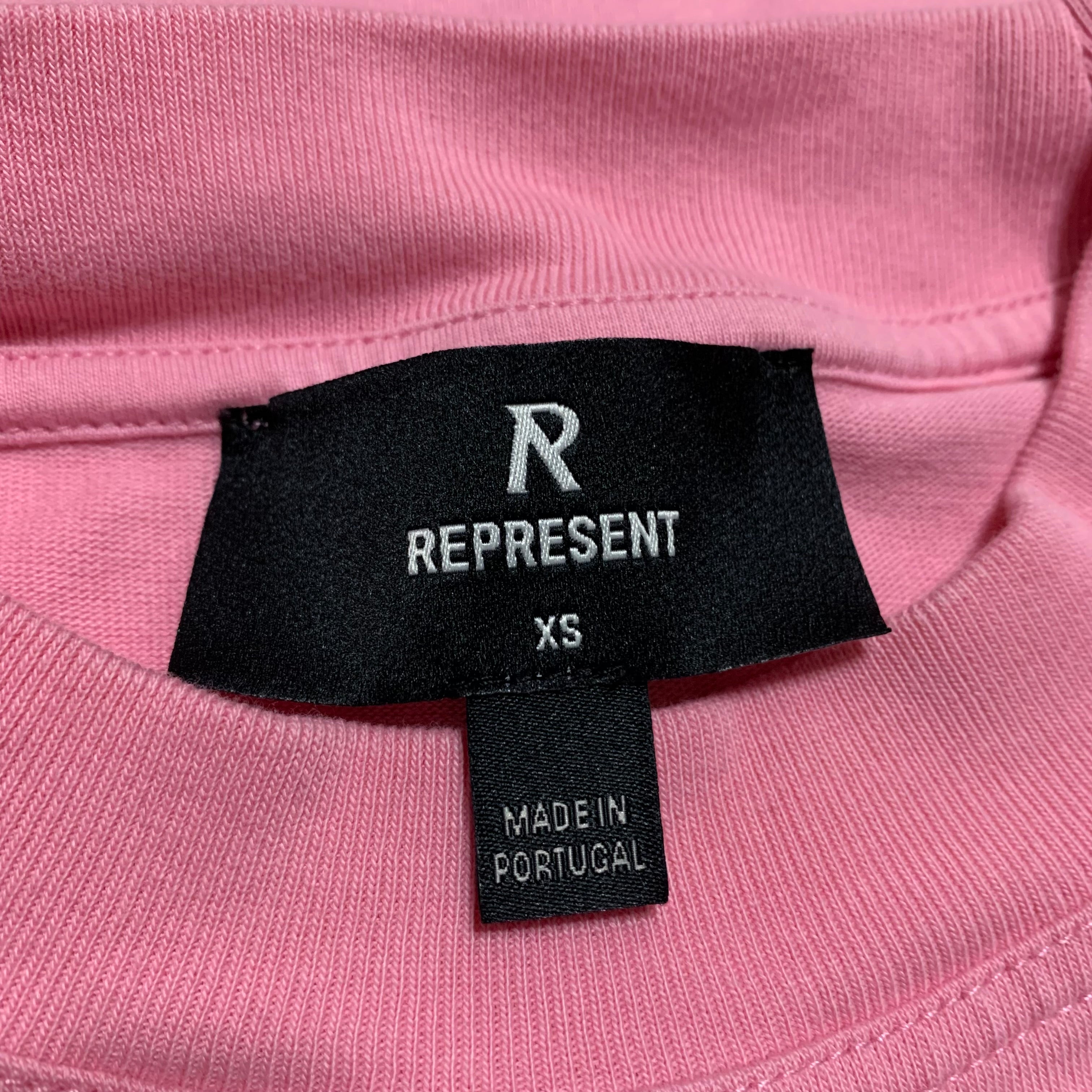 Represent XS Owners Club Script Pink Tee