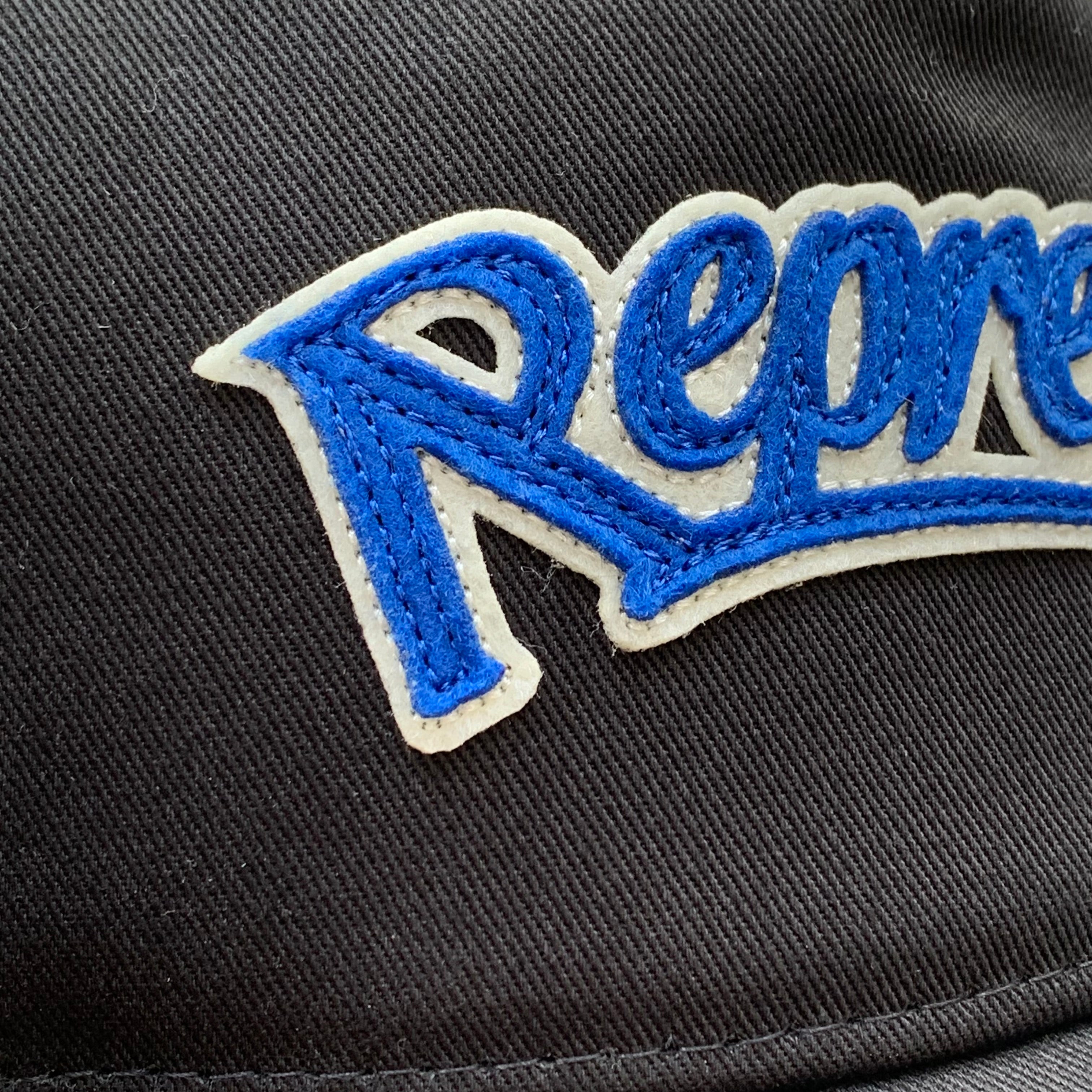 Represent Cap Showcasing Black Cap Hat