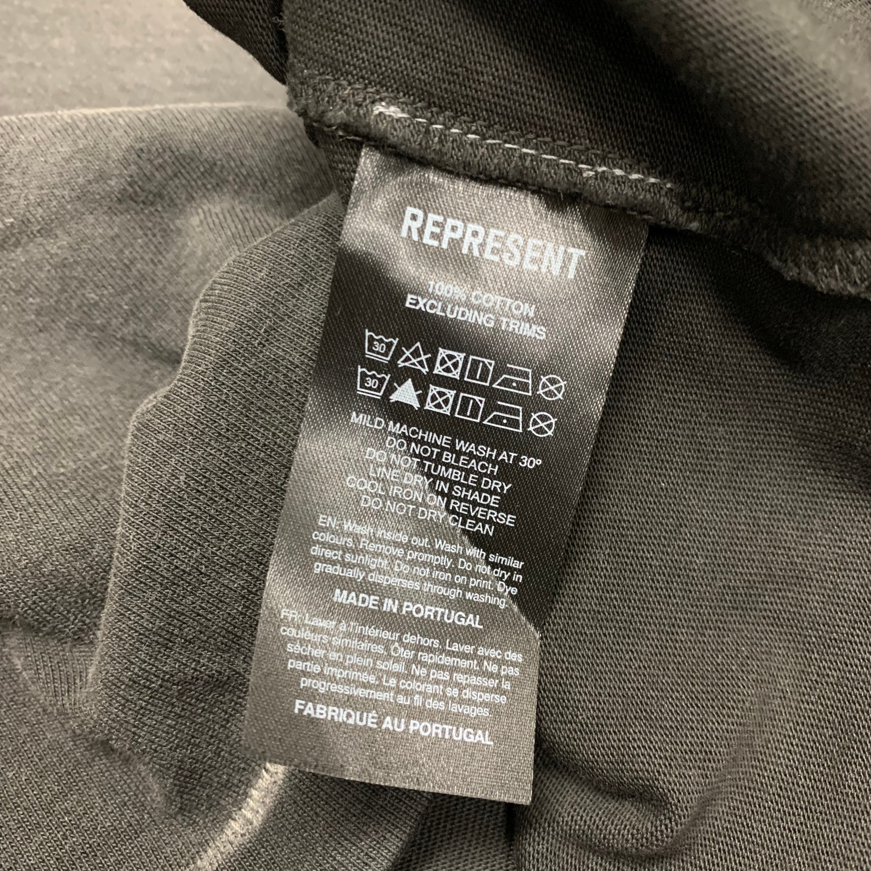 Represent Medium Tee Showcasing Stained Black T-Shirt
