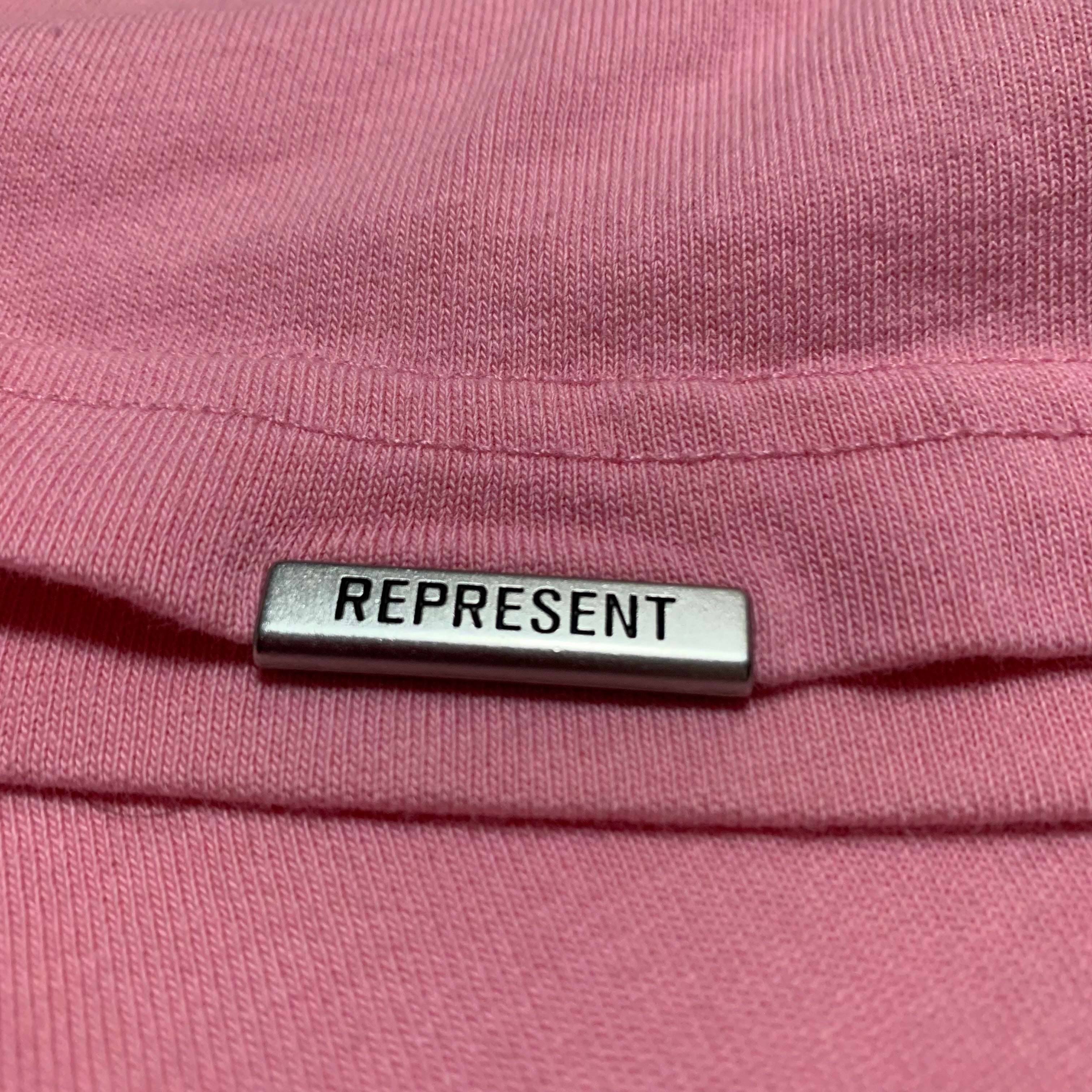 Represent XS Owners Club Script Pink Tee